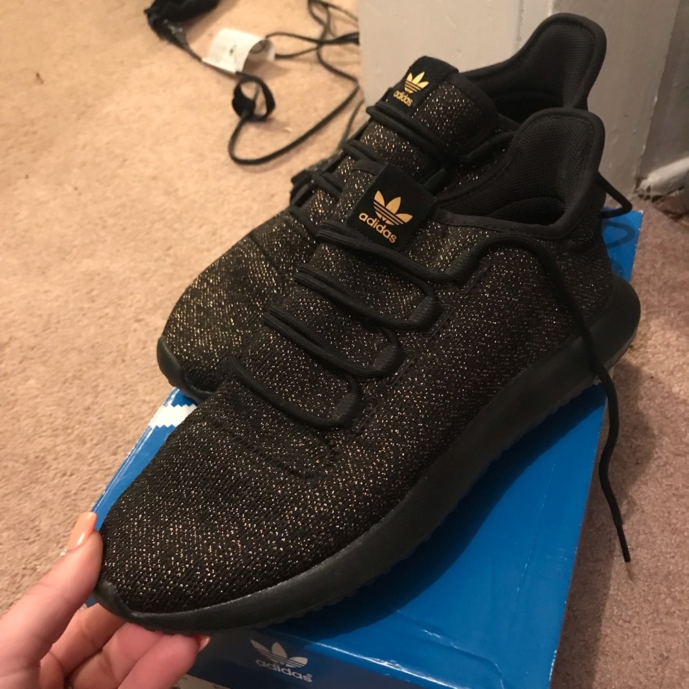 Black with gold sparkles adidas tubular shadow 3